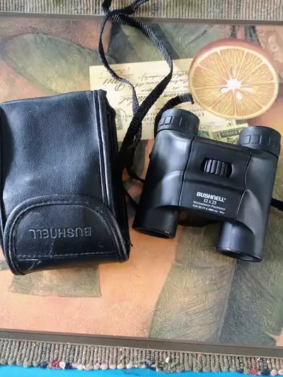 Bushnell binoculars 12x25 waterproof/fogproof.