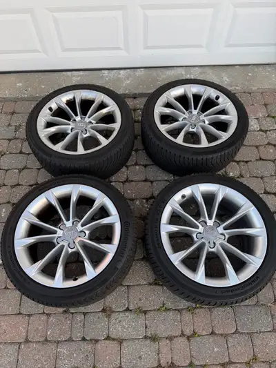 Selling a set of 4 genuine Audi OEM 18” alloy wheels with Continental VikingContact 7 winter tires (...