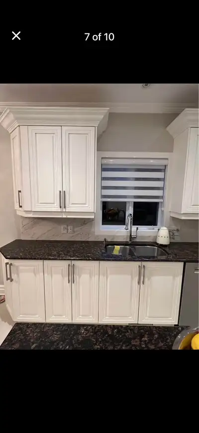 PRICED TO SELL - Wood Kitchen cabinets 156”x 140”x 150”, island 63”x 27” , includes granite counter...