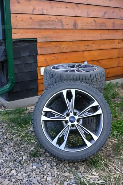 Set of 4 Ford rims with tires. Rims are in decent overall shape and would make a good spare set for...