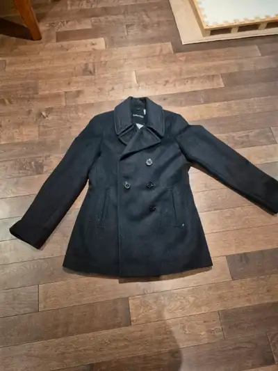 Calvin Klein black wool coat. Length: to the waist. Size 8/ medium. In great condition as it has nev...