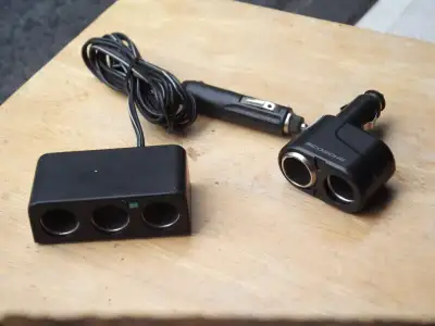 2 BRAND NEW CAR PLUG-INS FOR THE CIGARETE UNIT OUT LETS IN CARS, TRUCKS, OR WHATEVER -PRICE IS FOR B...