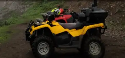 2004 can am 2 up comes with tracks plow and storage motivated to sell not giving it away ..