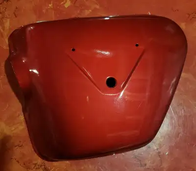 1969-1973 Honda CB450 K2 K3 DOHC Side Cover, LEFT, Red. Metal. New Old Stock (NOS) from an estate. P...