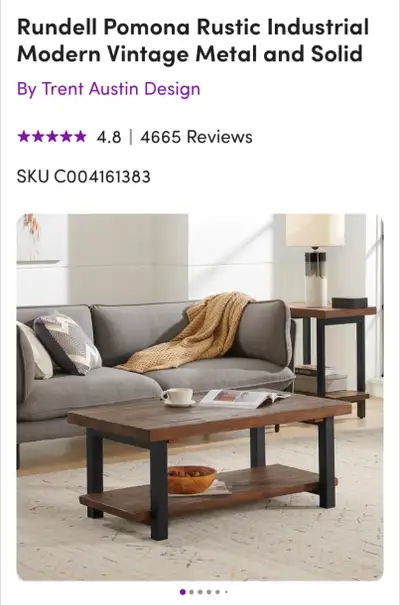 Selling a coffee table and 2 end table set. Crafted from solid natural wood and sleek black metal to...