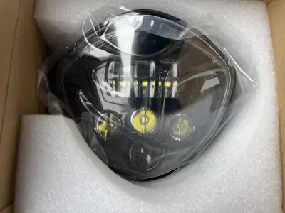 Led motorcycle headlight - new. See photos for approximate measurements, very bright around 23w low...