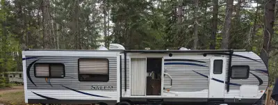 This Beautiful Park Model Trailer is a 38ft 2016 Salem Forest River Travel Trailer with 2 large pop-...