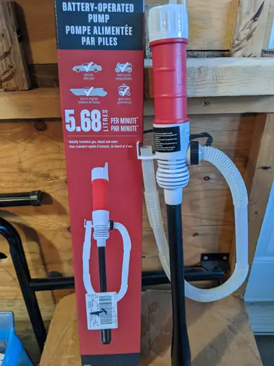 Slightly used , works like new . Pumps from 20 Ltr can to smaller can quickly with no spill. D size...