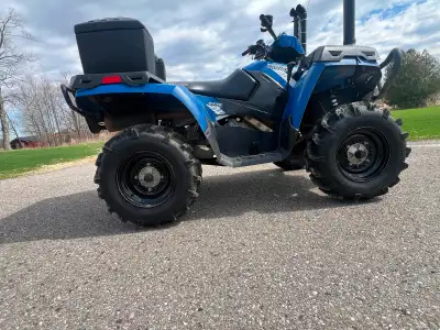 Awesome 2014 Polaris Sportsman 400 HO . Blue color strong machine almost new. Has snorkels for muddi...