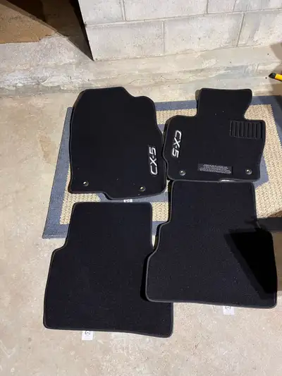 Brand new set of floor mats for Mazda CX5. Fits model years 2013-2016. May fit others. Mazda part #...