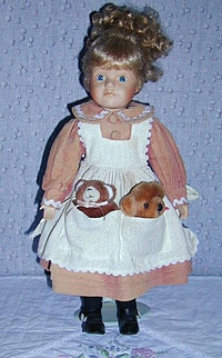 Porcelain Doll with 2 Bears in pocket .. Excellent Condition ..