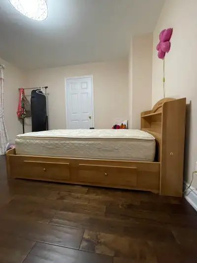 Bed frame - Canadian made solid wood twin bed with storage drawers and a bookshelf headboard. The be...