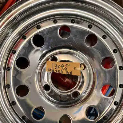 I have one new never mounted trailer rim for sale. 4 bolt 13 in diameter chrome new never mounted
