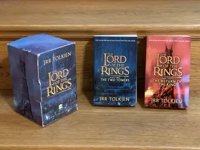 2 Lord of the Rings trilogy books with case, View more