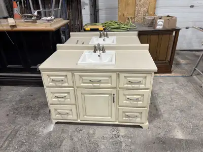 2 matching 48” solid wood vanities, meant to go in a left and right corner. 49” countertops with sin...