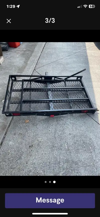 This black trailer cargo carrier is designed to attach to your vehicle's trailer hitch, providing ex...