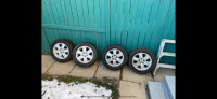 215/60/16 Firestone studded tires on rims