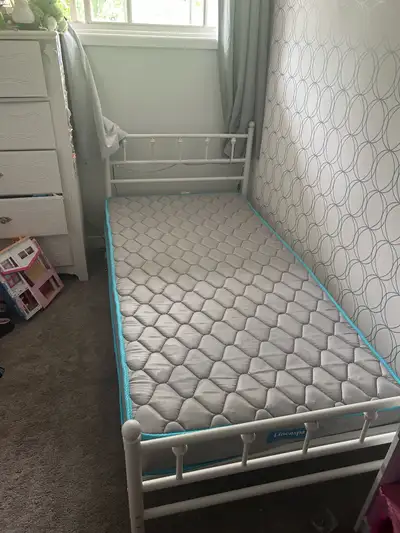 white metal twin bed was only used for a year. Great for a kids room!! Twin Mattress can be included...