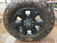 4 Stock Dodge 3500 35X12.5 R20 Tires on Black wheels