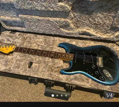 Brand new condition. Comes with case and case candy. Wicked guitar but strats are not for me. Paint...