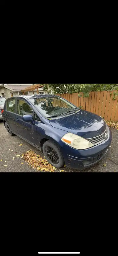 First thing - ALBERTA registered ! Versa -4 door hatch back - power windows and locks Standard - bra...