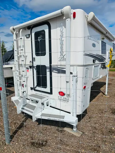 This is a top of the line camper and barely used. Also comes with Torklift camper tiedowns. All Blac...
