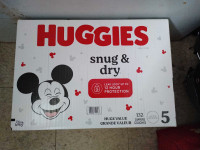 Brand New box of Huggies snug and dry size 5