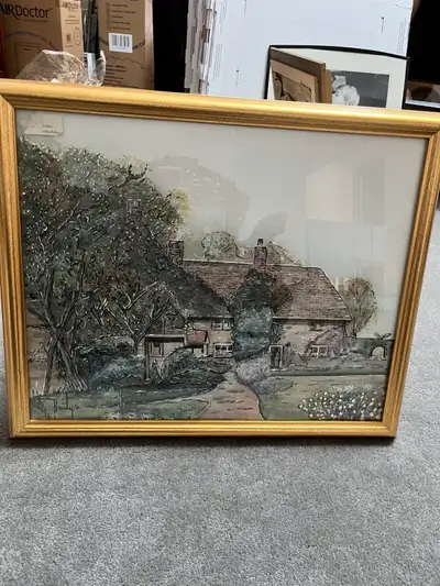 Vintage Framed painting of a cottage with trees and a path. The painting is signed by Brady'e. It is...