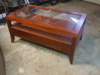 Solid wood, glass topped coffee table