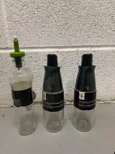 Three oil bottles, two frying pans and two spatulas, View more