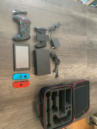 Nintendo Switch and deluxe system travel case, View more