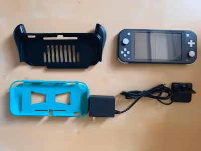 Nintendo Switch Lite (Grey) in great condition: -Extra screen protector I'll include in bundle to re...