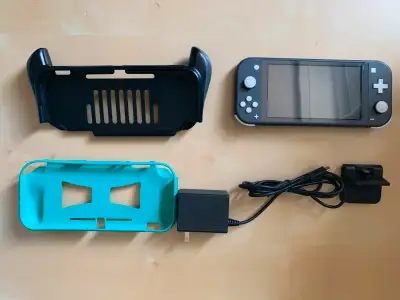 Nintendo Switch Lite (Grey) in great condition: -Extra screen protector I'll include in bundle to re...