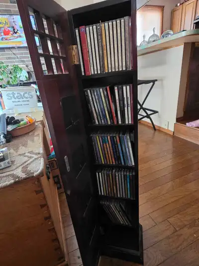 Offering a collection of 70 jazz CDs, these classic tunes are housed in a unique, upcycled CD tower...