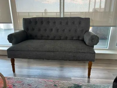 Grey upholstered love seat, View more