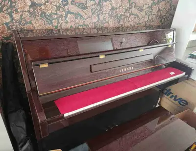 Yamaha C109 PM Upright Piano Polished mahogany Including matching piano bench and keyboard cover lin...