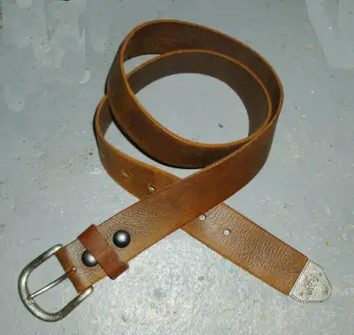 Made in Canada 100% genuine leather by Keldon. Metal western style end tip piece. Snap buttons to ch...