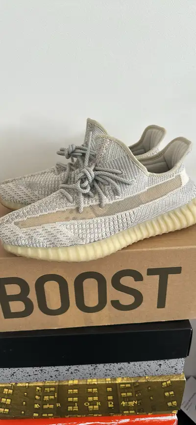 These Adidas Yeezy Boost 350 V2 sneakers are in excellent pre-owned condition and feature the iconic...