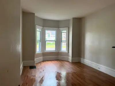 Move into this spacious, character‑filled 2‑bedroom, 1‑bath main‑floor apartment featuring high ceil...