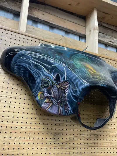 This custom-painted Harley-Davidson fairing is a jaw-dropping fusion of fantasy, darkness, and raw a...
