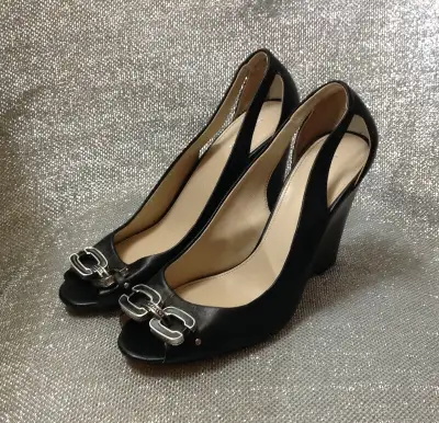 Coach New York Larchment wedge shoes. Beautiful soft black leather with metal double C and Coach log...