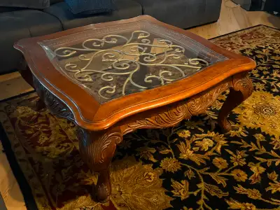 Solid wood with glass and metal coffee table. Size 40”x40”. I also have a side table for $150