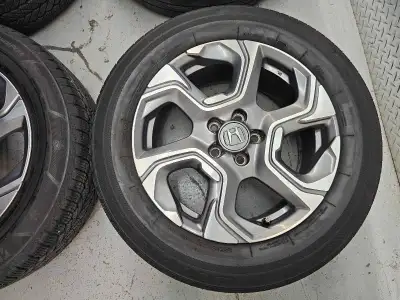 Set of 4 original 18" Honda crv rims with BRIDGESTONE all weather tires on them 235/60/R18. 2 tires...