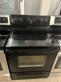 Whirlpool glass top stove has a black finish 