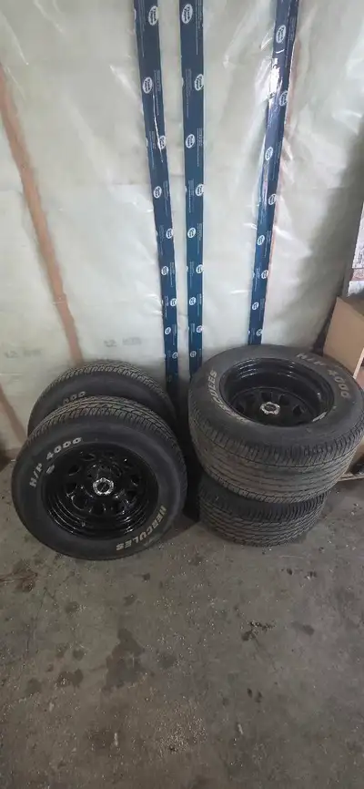 Set of rims for sale Fronts are 5x4.5 235 60 r15 on a 7" wide steel rims with centre cap front tires...