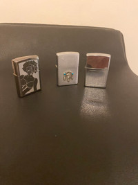 3 vintage Zippo lighters.