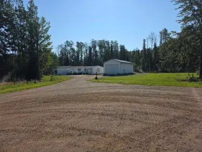 5 bedroom 2 full bathroom home on private 5 acres with a 60x30 shop. Located in Fort Nelson and only...