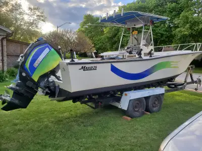25 ft Mako center console fiberglass boat with 200 h.p. evinrude high output E-tech outboard, with s...