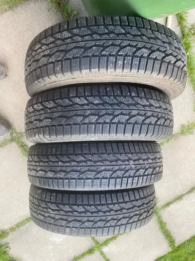 A set of 4 Firestone Winter Tires with lots of tread pretty evenly worn in great condition on Hyunda...