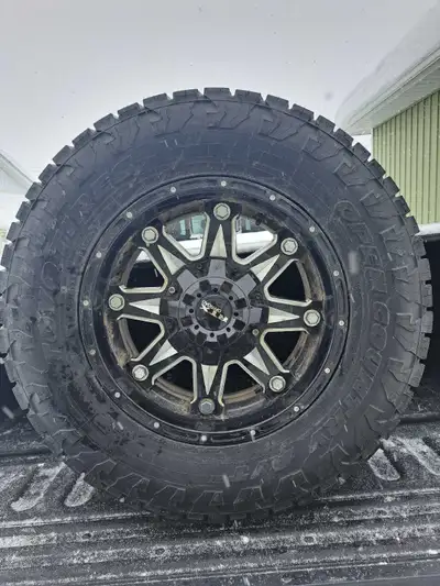 Set of 4 rtx wheels with dual bolt pattern 6x135 and 6x139.7 with ford sensors and toyo open country...